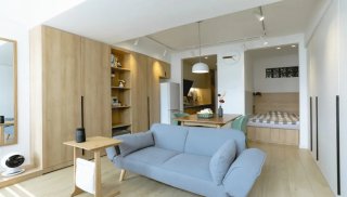 30平米长条户型原木风格单身公寓装修实拍图